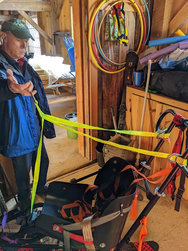 Adaptive skiing lift rescue harness